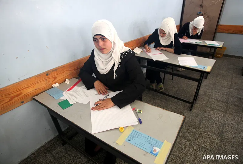 Palestinian Prime Minister in Gaza Strip, Ismail Haniya, (not seen) visits students as they sit for their final high school exams, known as "Tawjihi", in Gaza City on June 09, 2012. Photo by Yasser Fathi