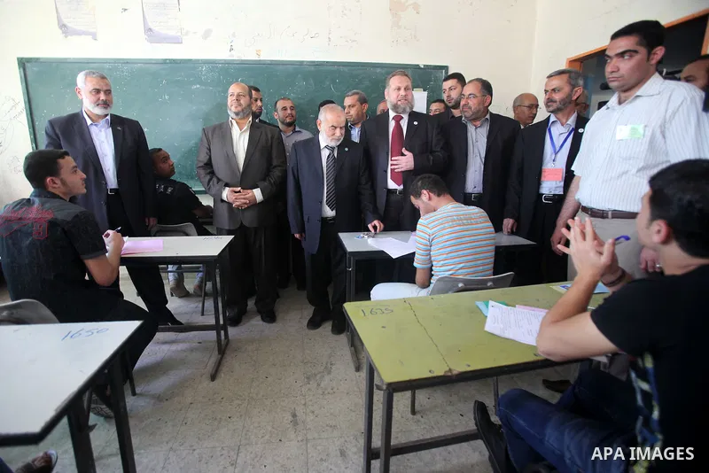 Palestinian Prime Minister in Gaza Strip, Ismail Haniya, visits students as they sit for their final high school exams, known as "Tawjihi", in Gaza City on June 09, 2012. Photo by Yasser Fathi