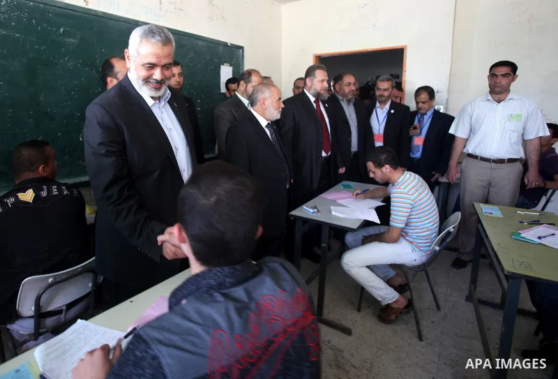 Palestinian Prime Minister in Gaza Strip, Ismail Haniya, visits students as they sit for their final high school exams, known as "Tawjihi", in Gaza City on June 09, 2012. Photo by Yasser Fathi