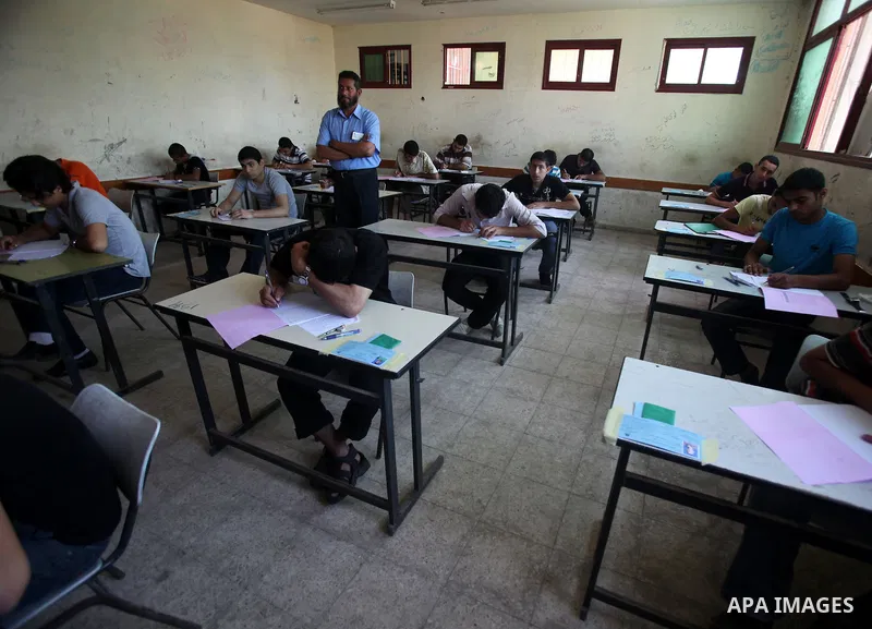 Palestinian Prime Minister in Gaza Strip, Ismail Haniya, (not seen) visits students as they sit for their final high school exams, known as "Tawjihi", in Gaza City on June 09, 2012. Photo by Yasser Fathi