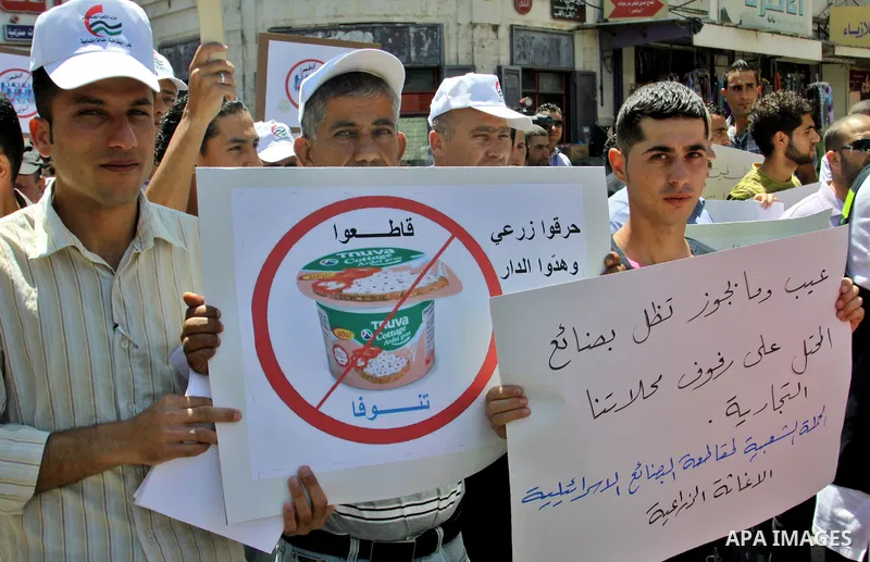 Palestinians demonstrate for a boycott of Israeli goods and support national products during a protest in the West Bank city of Nablus,on June 9,2012. Photo by Nedal Shtieh