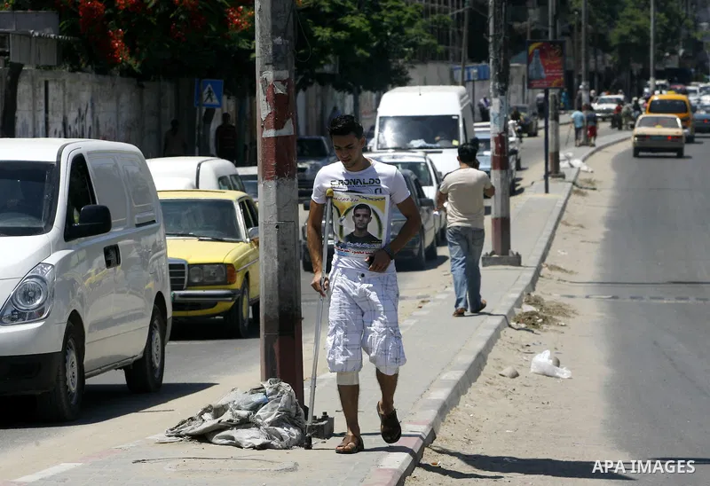 Palestinians hold posters depicting prisoners Mahmoud Al-Sarsak, and Akram al-Rekhawi during a rally in solidarity with them, in Rafah, in the southern Gaza Strip June 9, 2012. Al-Sarsak and al-Rekhawi, two Palestinian p...