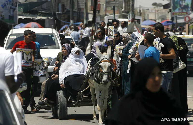 Palestinians hold posters depicting prisoners Mahmoud Al-Sarsak, and Akram al-Rekhawi during a rally in solidarity with them, in Rafah, in the southern Gaza Strip June 9, 2012. Al-Sarsak and al-Rekhawi, two Palestinian p...