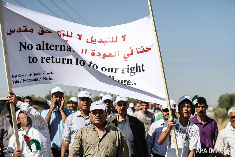 Palestinian demonstrators and Israeli forces clash after a protest by Palestinians calling for the return of displaced Palestinians to their villages occupied by Israel in 1967, in the West Bank village of Beit Nuba, nea...