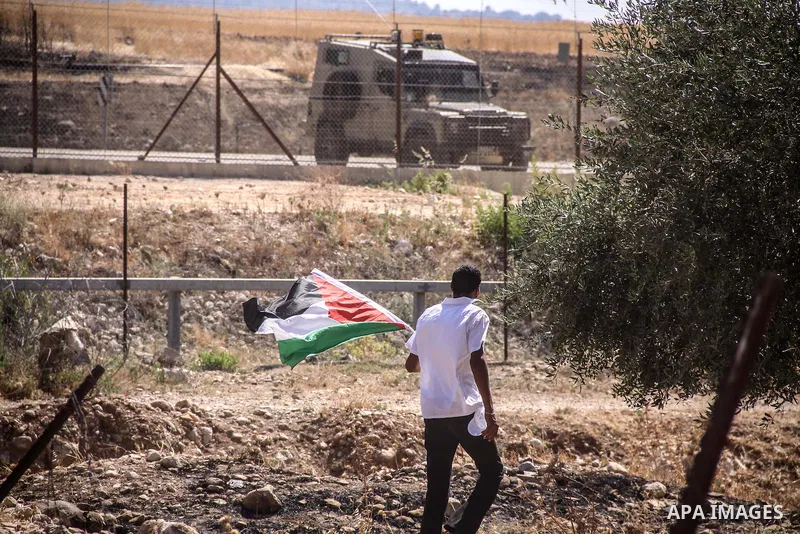 Palestinian demonstrators and Israeli forces clash after a protest by Palestinians calling for the return of displaced Palestinians to their villages occupied by Israel in 1967, in the West Bank village of Beit Nuba, nea...