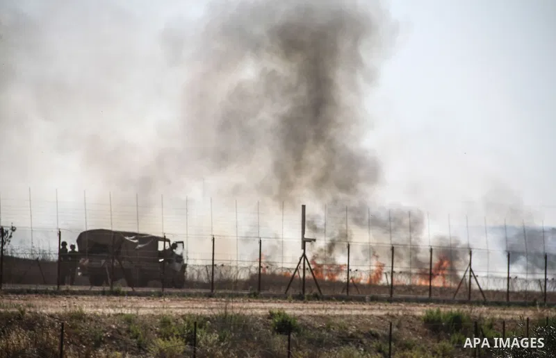 Palestinian demonstrators and Israeli forces clash after a protest by Palestinians calling for the return of displaced Palestinians to their villages occupied by Israel in 1967, in the West Bank village of Beit Nuba, nea...