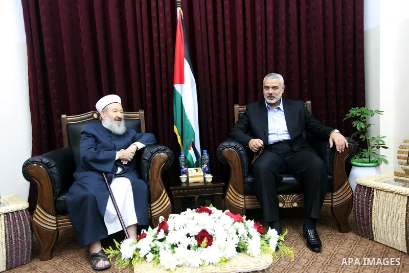 Palestinian Prime Minister in Gaza Strip, Ismail Haniya, meets with the world, Sheikh Abdel-Moneim Abu Alzant, in his office in Gaza City, on Jun 10,2012. Photo by Ahmed Shaat