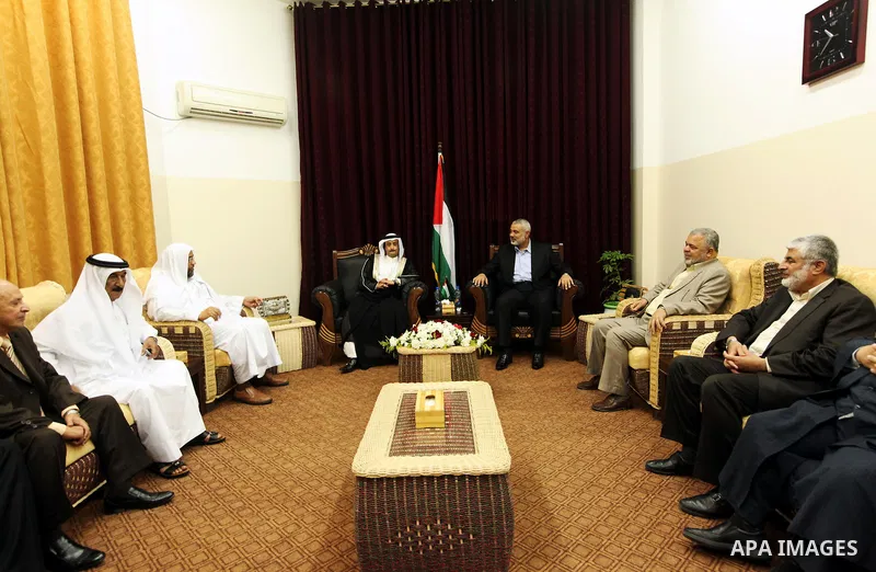 Palestinian Prime Minister in Gaza Strip, Ismail Haniya, meets with Qatar's Sheikh Ali Al Sada, in his office in Gaza City, on Jun 10,2012. Photo by Ahmed Shaat