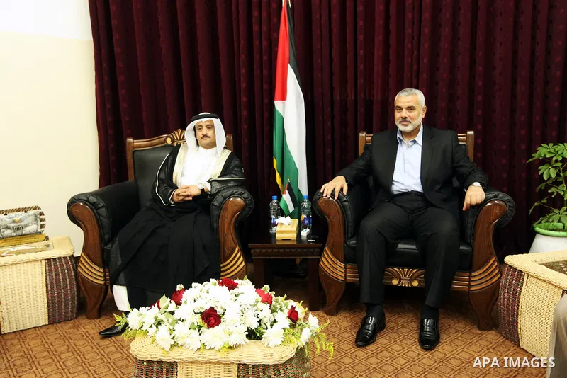 Palestinian Prime Minister in Gaza Strip, Ismail Haniya, meets with Qatar's Sheikh Ali Al Sada, in his office in Gaza City, on Jun 10,2012. Photo by Ahmed Shaat