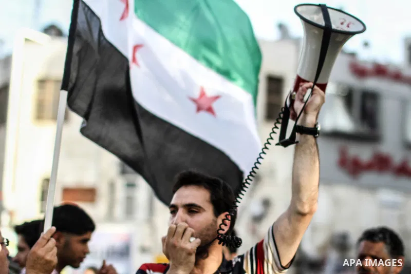 Palestinian protester shouts slogans during a demonstration solidarity with Syrian's revolution and against Bashar Al Asad rule in the West Bank city of Ramallah, on 10 June 2012. Photo by Ahmed Mesleh
