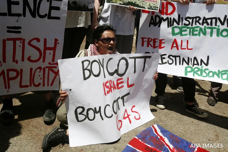 Palestinians and Foreigners hold posters depicting prisoners Mahmoud Al-Sarsak, and Akram al-Rekhawi during a rally in solidarity with them in the red cross offices in jerusalem city, on June 11, 2012. Photo by Mahfouz A...
