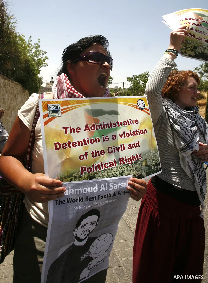 Palestinians and Foreigners hold posters depicting prisoners Mahmoud Al-Sarsak, and Akram al-Rekhawi during a rally in solidarity with them in the red cross offices in jerusalem city, on June 11, 2012. Photo by Mahfouz A...