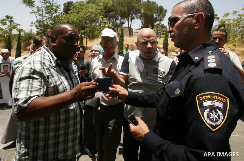 Palestinians and Foreigners hold posters depicting prisoners Mahmoud Al-Sarsak, and Akram al-Rekhawi during a rally in solidarity with them in the red cross offices in jerusalem city, on June 11, 2012. Photo by Mahfouz A...