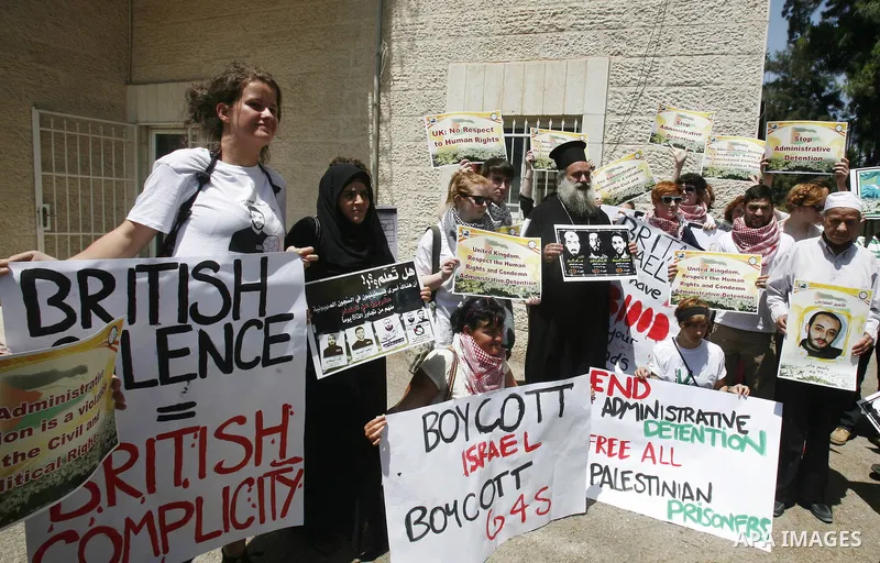 Palestinians and Foreigners hold posters depicting prisoners Mahmoud Al-Sarsak, and Akram al-Rekhawi during a rally in solidarity with them in the red cross offices in jerusalem city, on June 11, 2012. Photo by Mahfouz A...