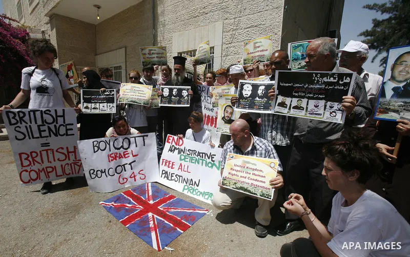 Palestinians and Foreigners hold posters depicting prisoners Mahmoud Al-Sarsak, and Akram al-Rekhawi during a rally in solidarity with them in the red cross offices in jerusalem city, on June 11, 2012. Photo by Mahfouz A...