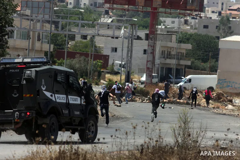 Israeli police clash with Palestinian protesters after a demonstration in front of Ofer prison, near the city of Ramallah, in solidarity with prisoners Mahmud Sarsak, Akram Rikhawi and Samir al-Baraka detained by Israel...