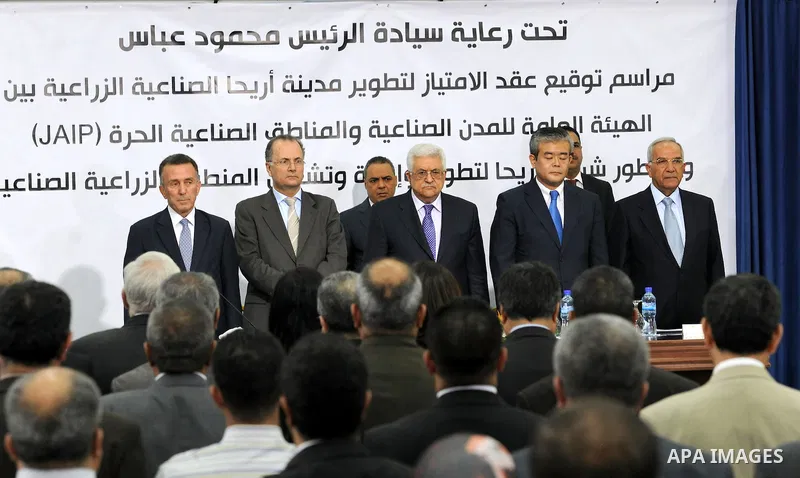 Palestinian President, Mahmoud Abbas (Abu Mazen), signs the franchise agreement with the Japanese government in the West Bank city of Ramallah on June 12, 2012. Photo by Thaer Ganaim
