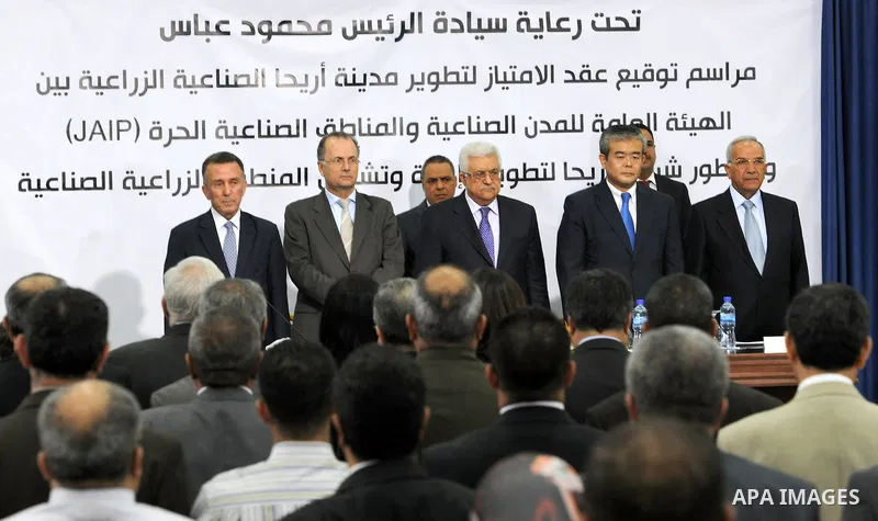 Palestinian President, Mahmoud Abbas (Abu Mazen), signs the franchise agreement with the Japanese government in the West Bank city of Ramallah on June 12, 2012. Photo by Thaer Ganaim