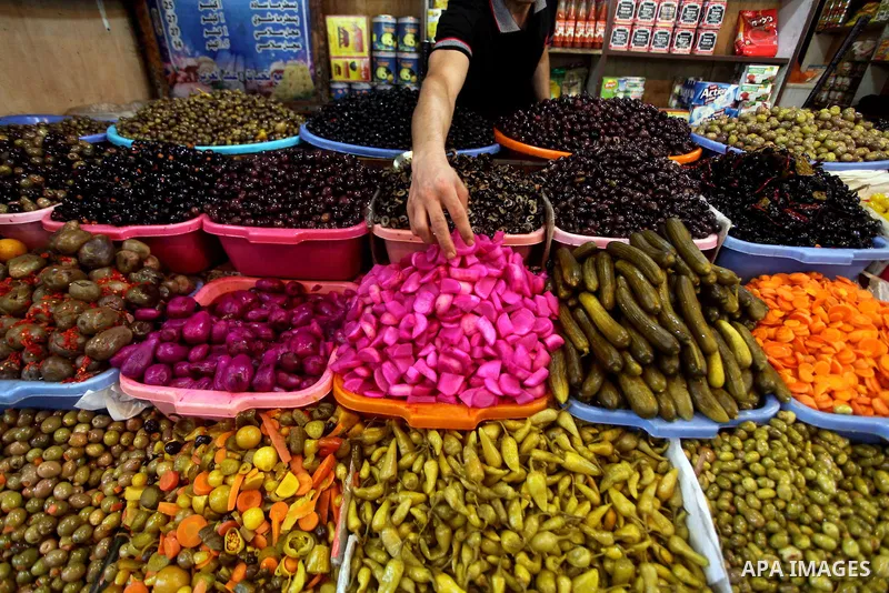 A Palestinian vendor sells pickles at the popular AlZawya market in Gaza City on June. 12, 2012 . Photo by Ashraf Amra