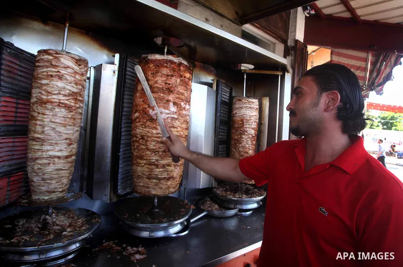 A Palestinian vendor sells shawarma in his restaurant at the popular AlZawya market in Gaza City on June. 12, 2012 . Photo by Ashraf Amra