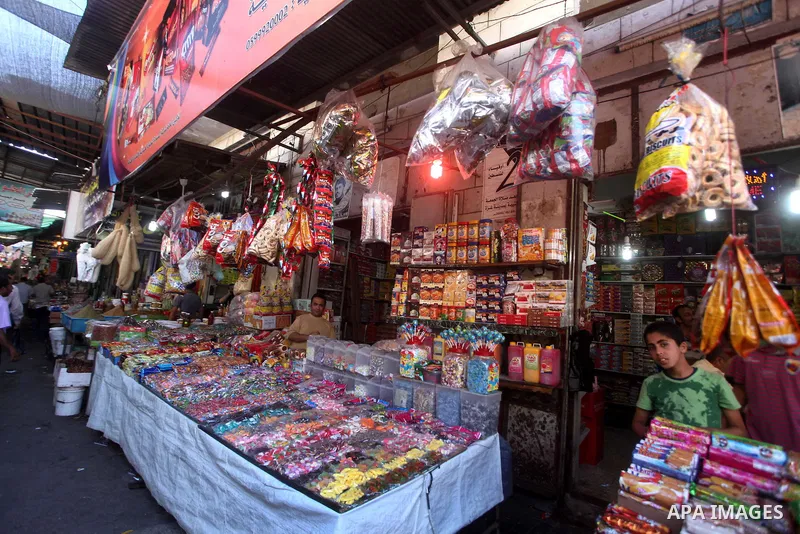 A Palestinian child sells grocery at the popular AlZawya market in Gaza City on June. 12, 2012 . Photo by Ashraf Amra