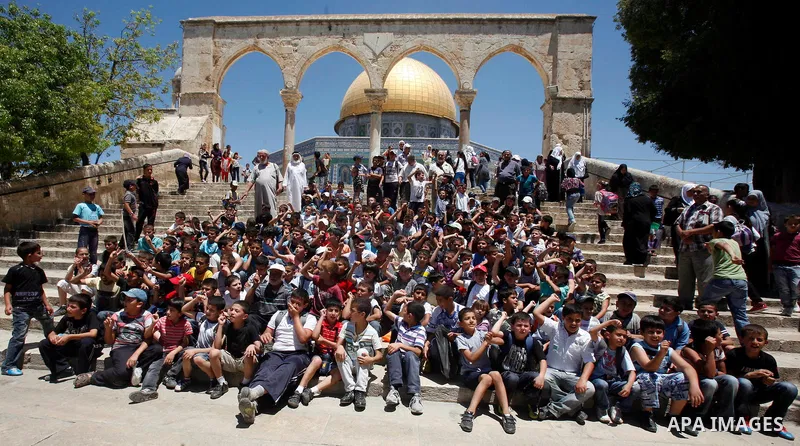 Palestinian children participate in summer camps at Al-Aqsa mosque in the old city of Jerusalem on 12 June 2012. Photo by Mahfouz Abu Turk
