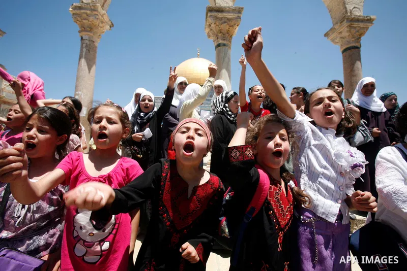 Palestinian children participate in summer camps at Al-Aqsa mosque in the old city of Jerusalem on 12 June 2012. Photo by Mahfouz Abu Turk