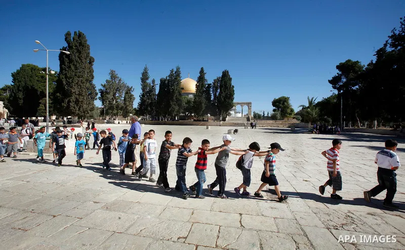 Palestinian children participate in summer camps at Al-Aqsa mosque in the old city of Jerusalem on 12 June 2012. Photo by Mahfouz Abu Turk