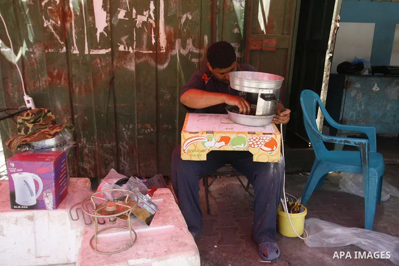 A Palestinian man works at his shop in Rafah, southern Gaza Strip on June 13, 2012. The European Union's envoy to the Palestinian Authority confirmed its support and allegiance to the people. Photo by Eyad Al Baba