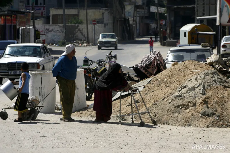 An elderly walk at a street in the Rafah refugee camp southern Gaza Strip on June 13, 2012. The European Union's envoy to the Palestinian Authority confirmed its support and allegiance to the people. Photo by Eyad Al Bab...