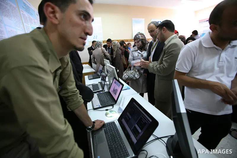 Palestinian students participate in the exhibition of "Creativity of the student" at the Palestine Polytechnic University in the West Bank city of Hebron on 13 June 2012. Photo by Mamoun Wazwaz