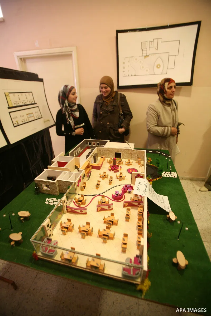 Palestinian students participate in the exhibition of "Creativity of the student" at the Palestine Polytechnic University in the West Bank city of Hebron on 13 June 2012. Photo by Mamoun Wazwaz
