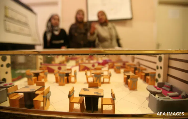 Palestinian students participate in the exhibition of "Creativity of the student" at the Palestine Polytechnic University in the West Bank city of Hebron on 13 June 2012. Photo by Mamoun Wazwaz