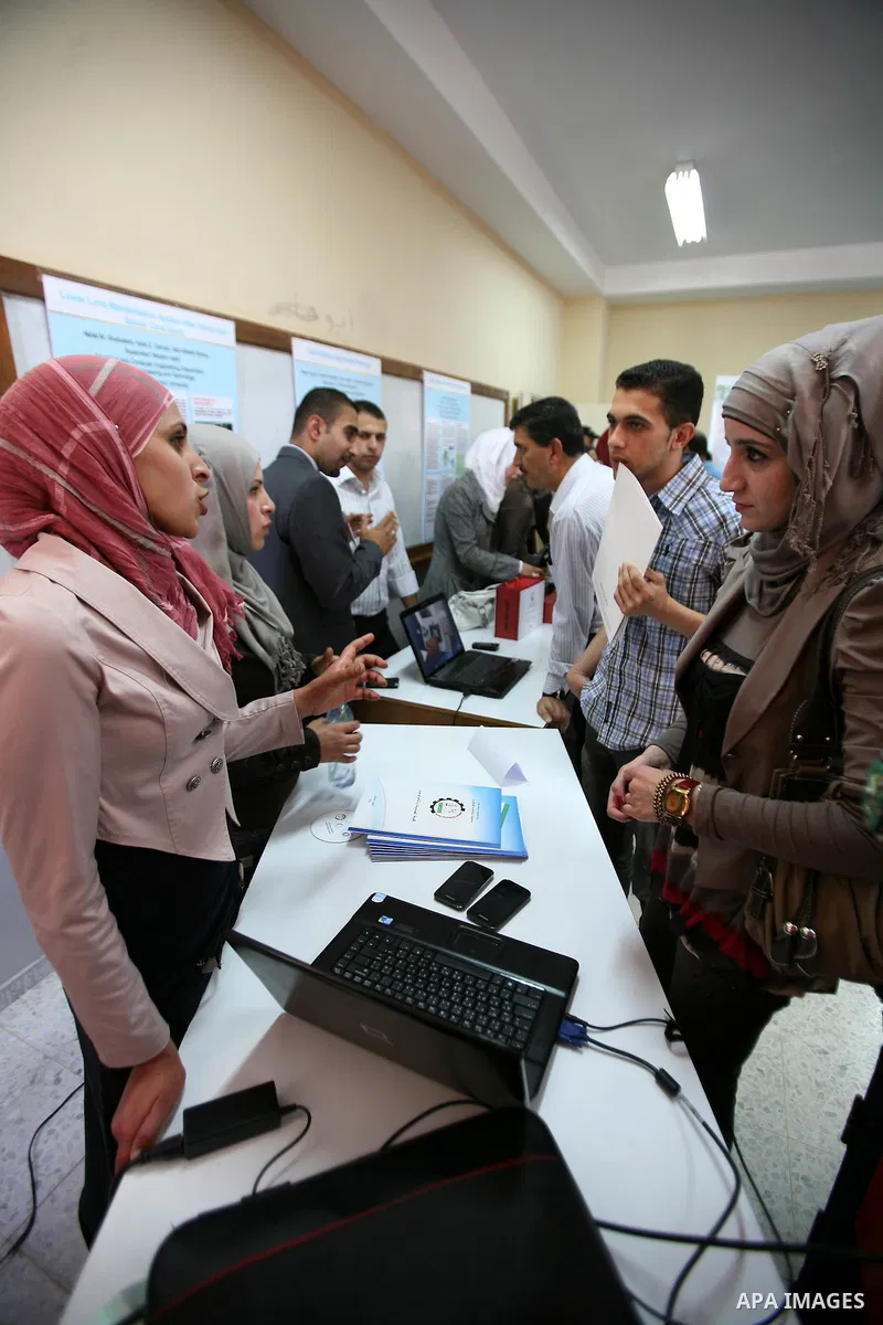 Palestinian students participate in the exhibition of "Creativity of the student" at the Palestine Polytechnic University in the West Bank city of Hebron on 13 June 2012. Photo by Mamoun Wazwaz