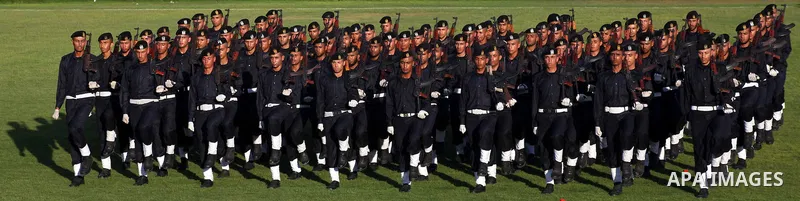 Graduating police officers march during a ceremony at the police academy in Gaza City on June 13, 2012, making them the first batch of officers to graduate after four years of training under the Hamas leadership. Hamas h...