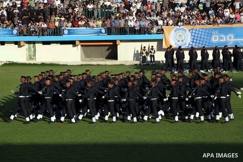 Graduating police officers march during a ceremony at the police academy in Gaza City on June 13, 2012, making them the first batch of officers to graduate after four years of training under the Hamas leadership. Hamas h...