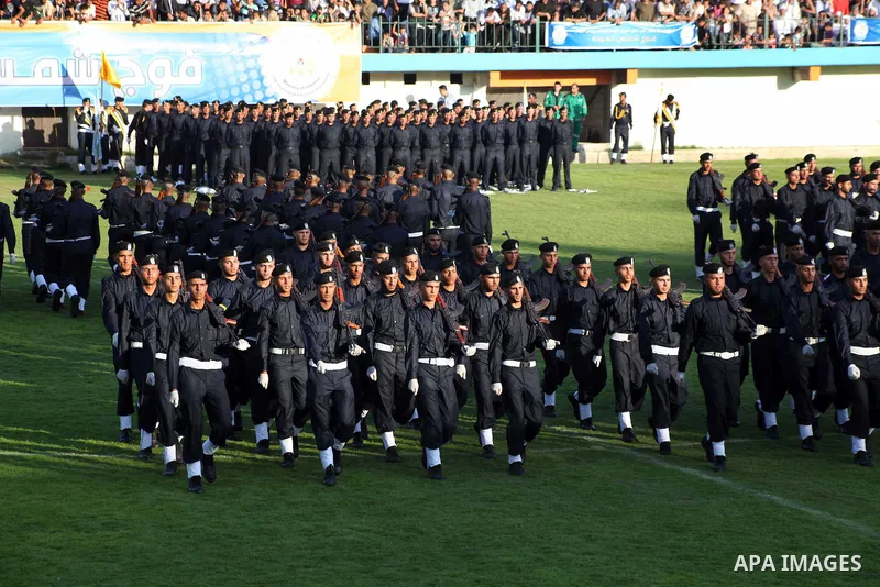 Graduating police officers march during a ceremony at the police academy in Gaza City on June 13, 2012, making them the first batch of officers to graduate after four years of training under the Hamas leadership. Hamas h...