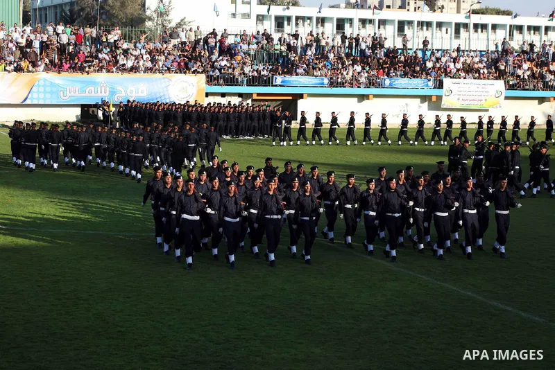 Graduating police officers march during a ceremony at the police academy in Gaza City on June 13, 2012, making them the first batch of officers to graduate after four years of training under the Hamas leadership. Hamas h...