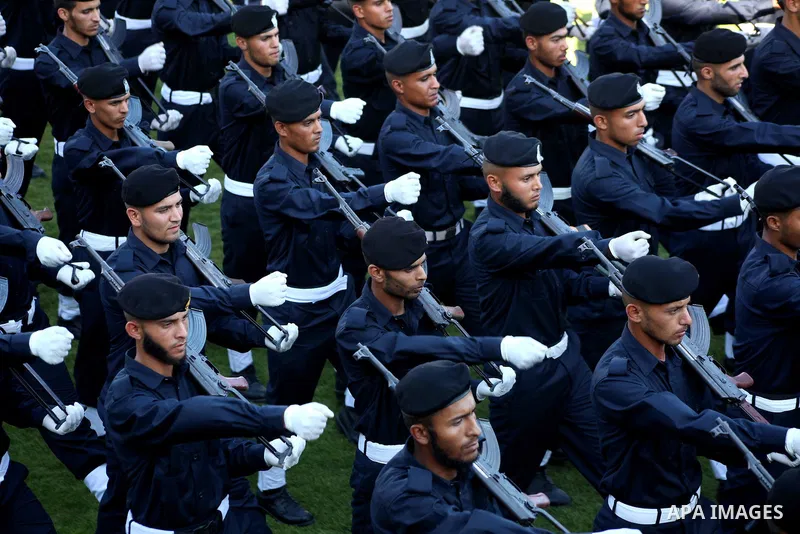 Graduating police officers march during a ceremony at the police academy in Gaza City on June 13, 2012, making them the first batch of officers to graduate after four years of training under the Hamas leadership. Hamas h...