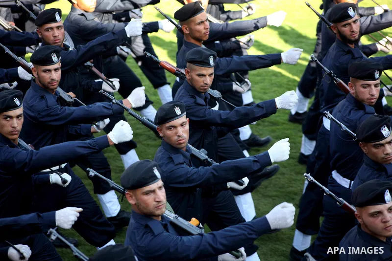Graduating police officers march during a ceremony at the police academy in Gaza City on June 13, 2012, making them the first batch of officers to graduate after four years of training under the Hamas leadership. Hamas h...