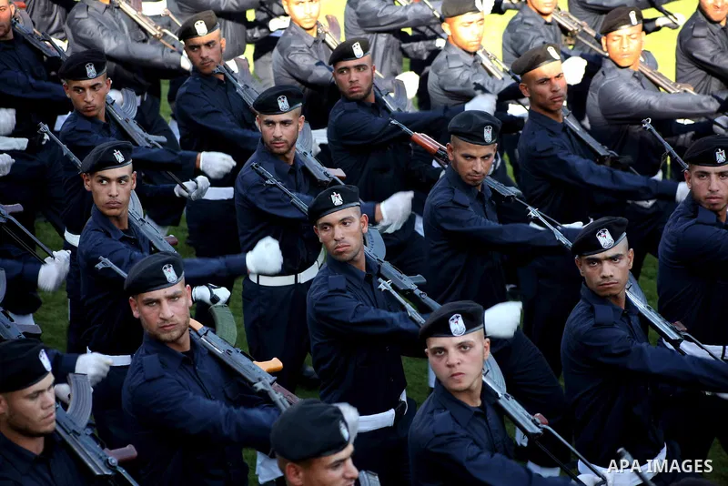 Graduating police officers march during a ceremony at the police academy in Gaza City on June 13, 2012, making them the first batch of officers to graduate after four years of training under the Hamas leadership. Hamas h...