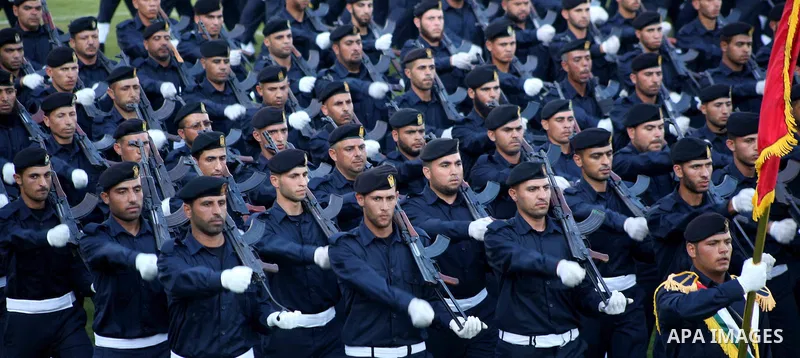 Graduating police officers march during a ceremony at the police academy in Gaza City on June 13, 2012, making them the first batch of officers to graduate after four years of training under the Hamas leadership. Hamas h...