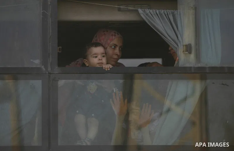 Palestinians load their luggage as they wait to cross into Egypt through the Rafah border crossing in the southern Gaza Strip on June 13, 2013. After the stopping of the Rafah border crossing from the Egyptian side Becau...