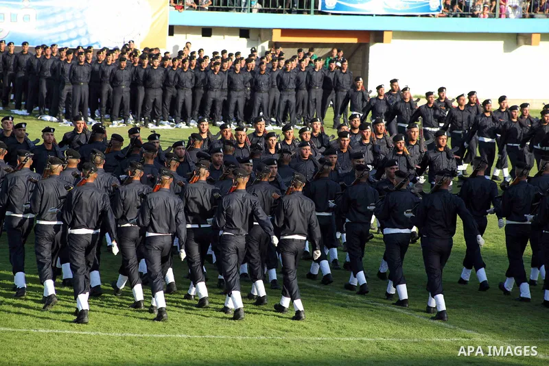 Graduating police officers march during a ceremony at the police academy in Gaza City on June 13, 2012, making them the first batch of officers to graduate after four years of training under the Hamas leadership. Hamas h...