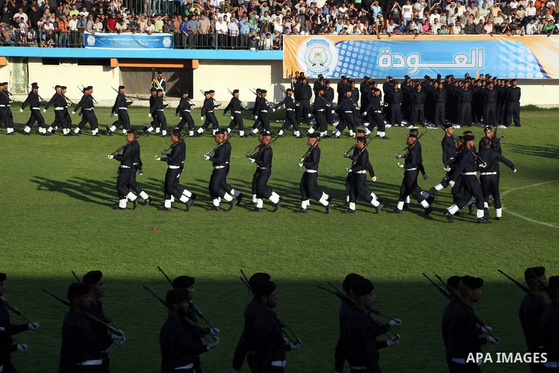 Graduating police officers march during a ceremony at the police academy in Gaza City on June 13, 2012, making them the first batch of officers to graduate after four years of training under the Hamas leadership. Hamas h...