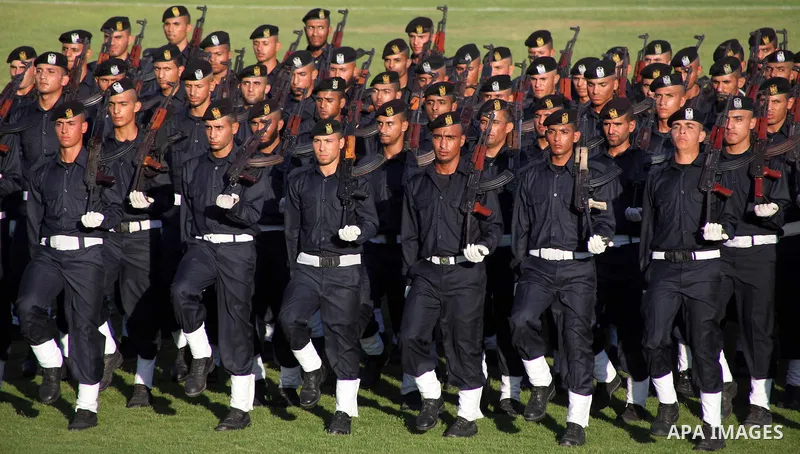 Graduating police officers march during a ceremony at the police academy in Gaza City on June 13, 2012, making them the first batch of officers to graduate after four years of training under the Hamas leadership. Hamas h...