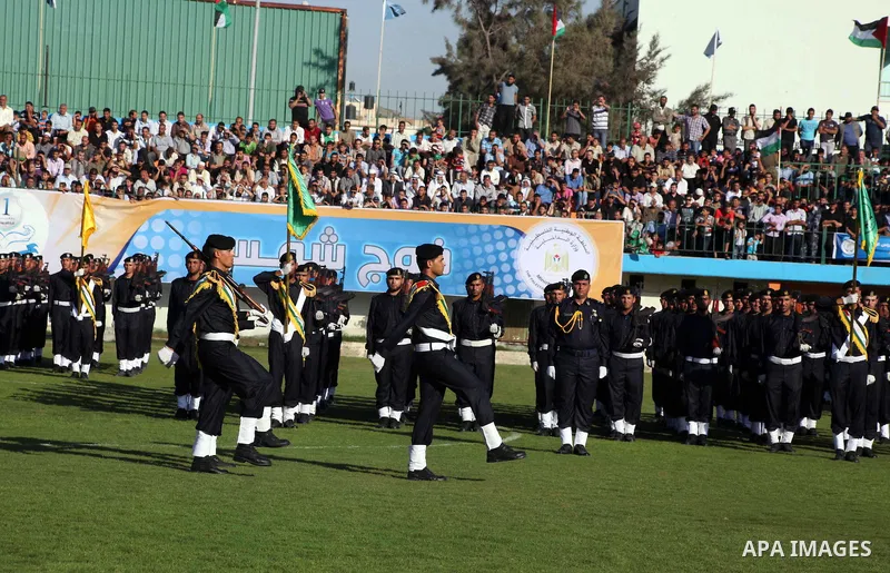 Graduating police officers march during a ceremony at the police academy in Gaza City on June 13, 2012, making them the first batch of officers to graduate after four years of training under the Hamas leadership. Hamas h...