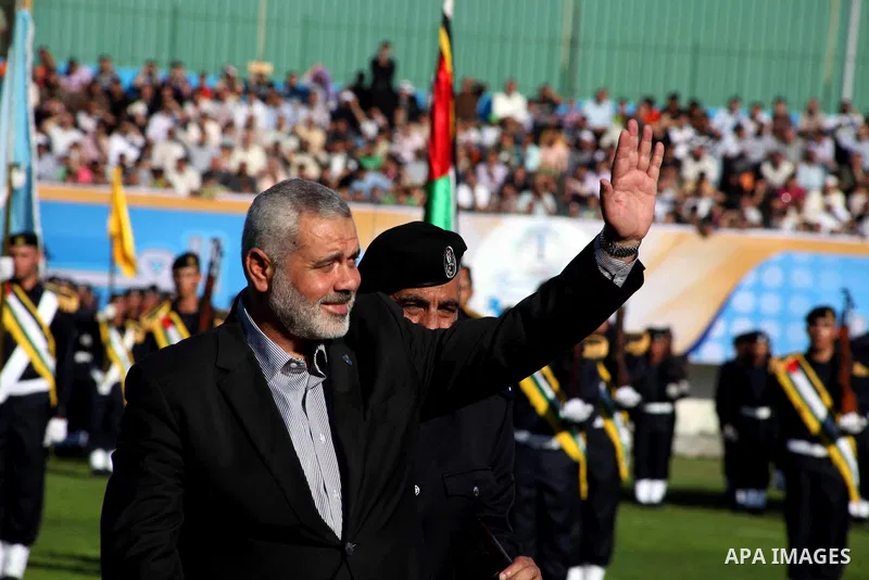 Palestinian Prime Minister in Gaza Ismail Hanyeh, participates graduation police officers ceremony at the police academy in Gaza City on June 13, 2012, making them the first batch of officers to graduate after four years...
