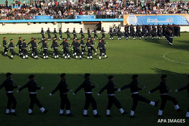 Graduating police officers march during a ceremony at the police academy in Gaza City on June 13, 2012, making them the first batch of officers to graduate after four years of training under the Hamas leadership. Hamas h...
