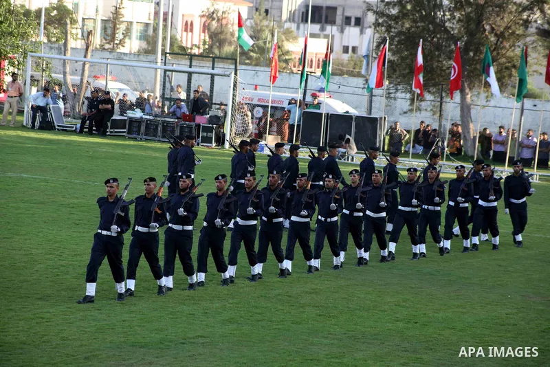 Graduating police officers march during a ceremony at the police academy in Gaza City on June 13, 2012, making them the first batch of officers to graduate after four years of training under the Hamas leadership. Hamas h...